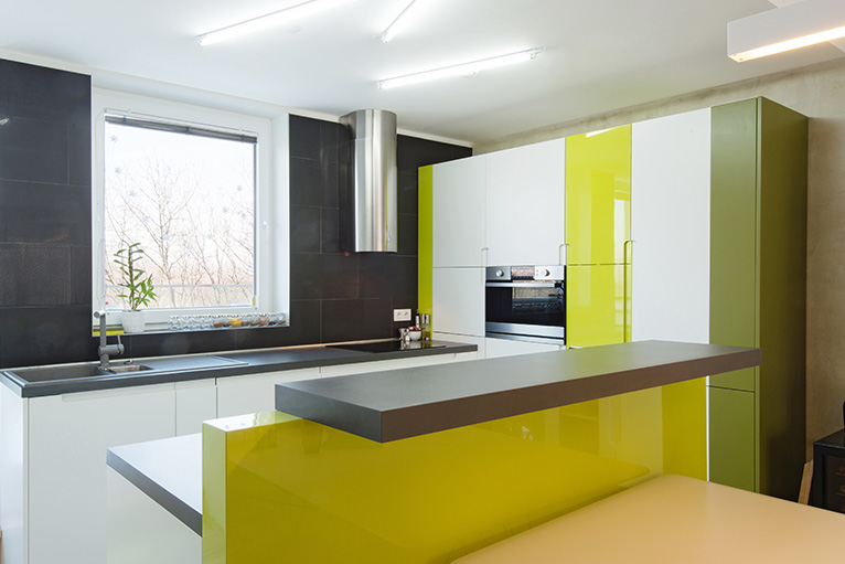 Colourful House Interior Design: Green and black kitchen