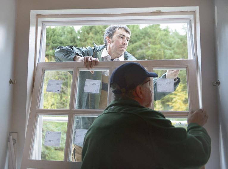 Window fitters at work