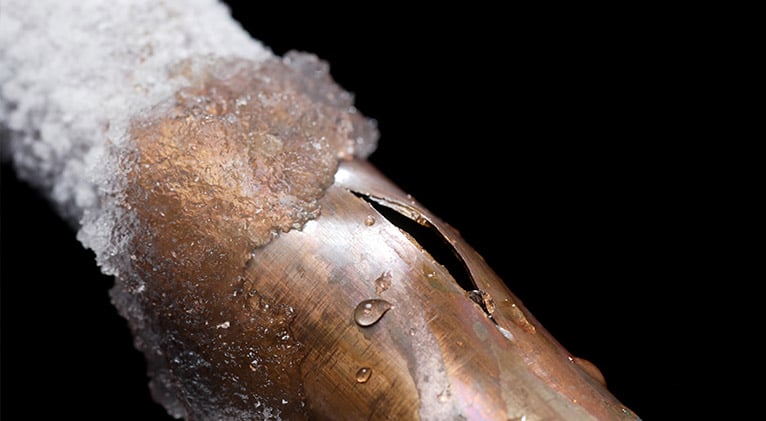 Copper pipe, frozen and split