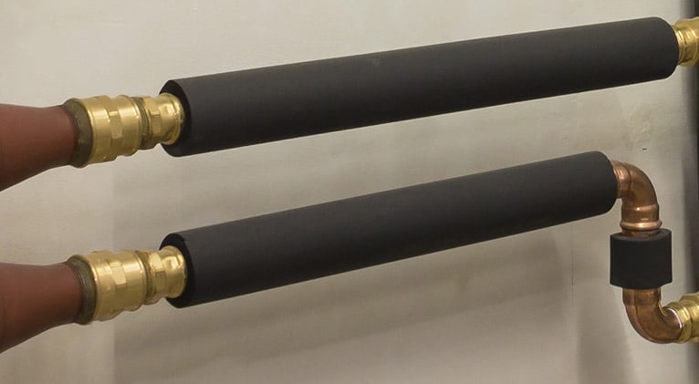 Pipes with black foam insulation covers