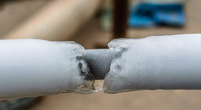 External pipe encased in ice 
