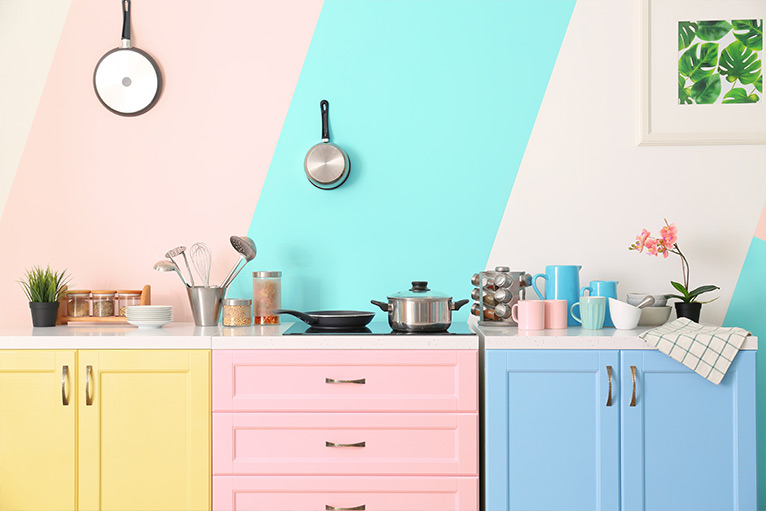 Kitchen design trend - cabinets and drawers in pastel yellow, pink and blue colours