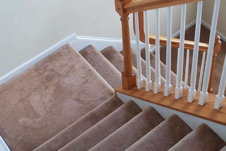 Carpeted stairs over landing