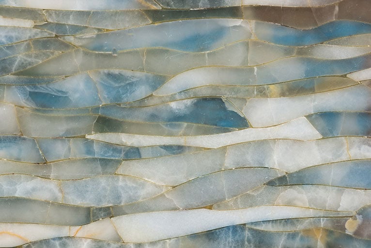 Sea foam coloured marble textured wallpaper