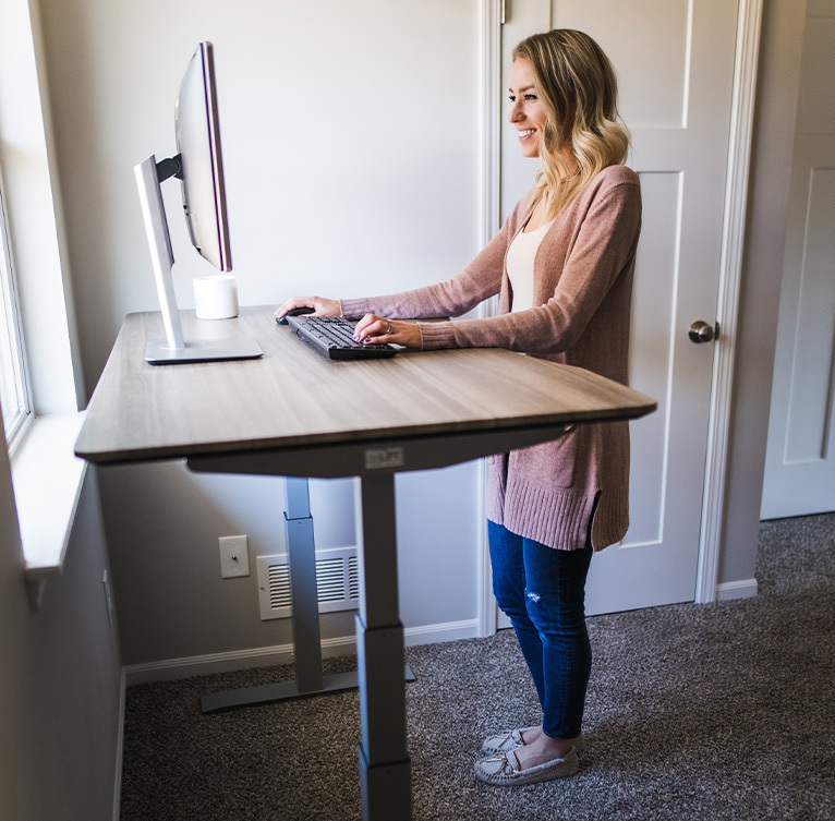Woman using standing desk