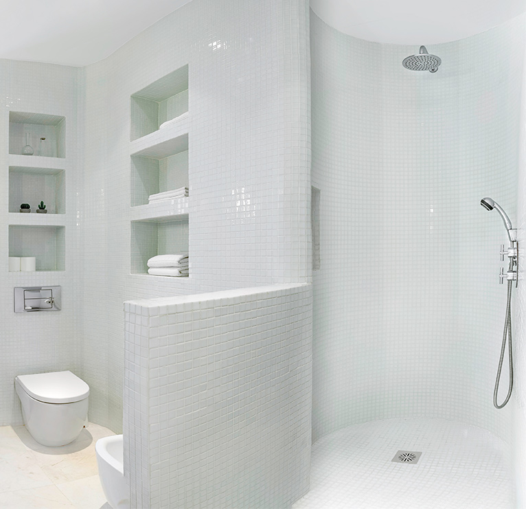All-white bathroom with walk-in shower