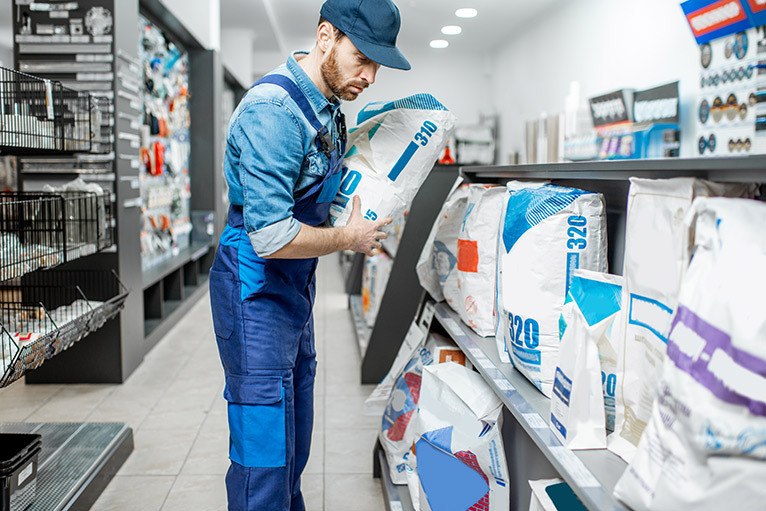 Tradesperson looking at products in builders' merchant