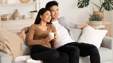 Smiling couple sitting on the sofa