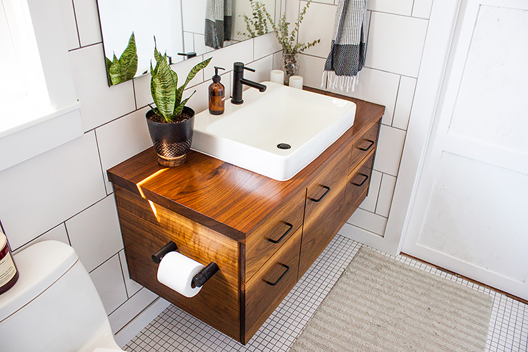 Wooden sink vanity unit with built-in toilet roll holder