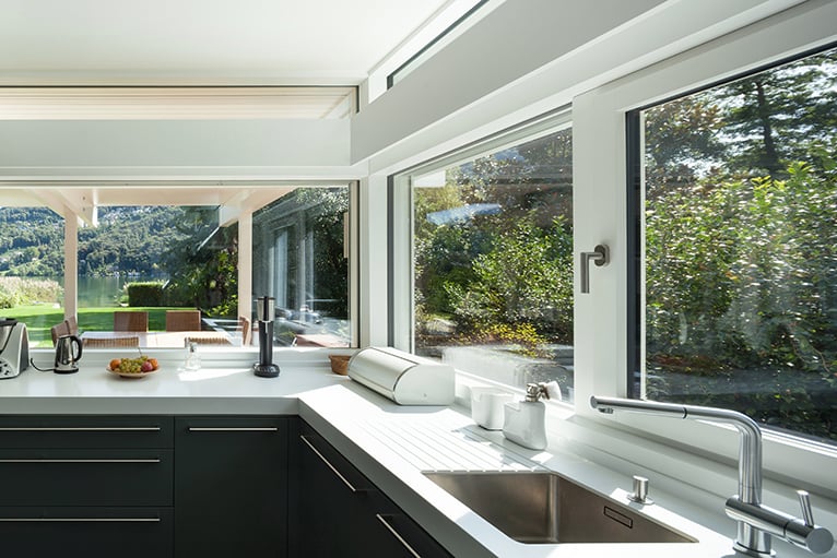 Kitchen with multiple window looking into garden
