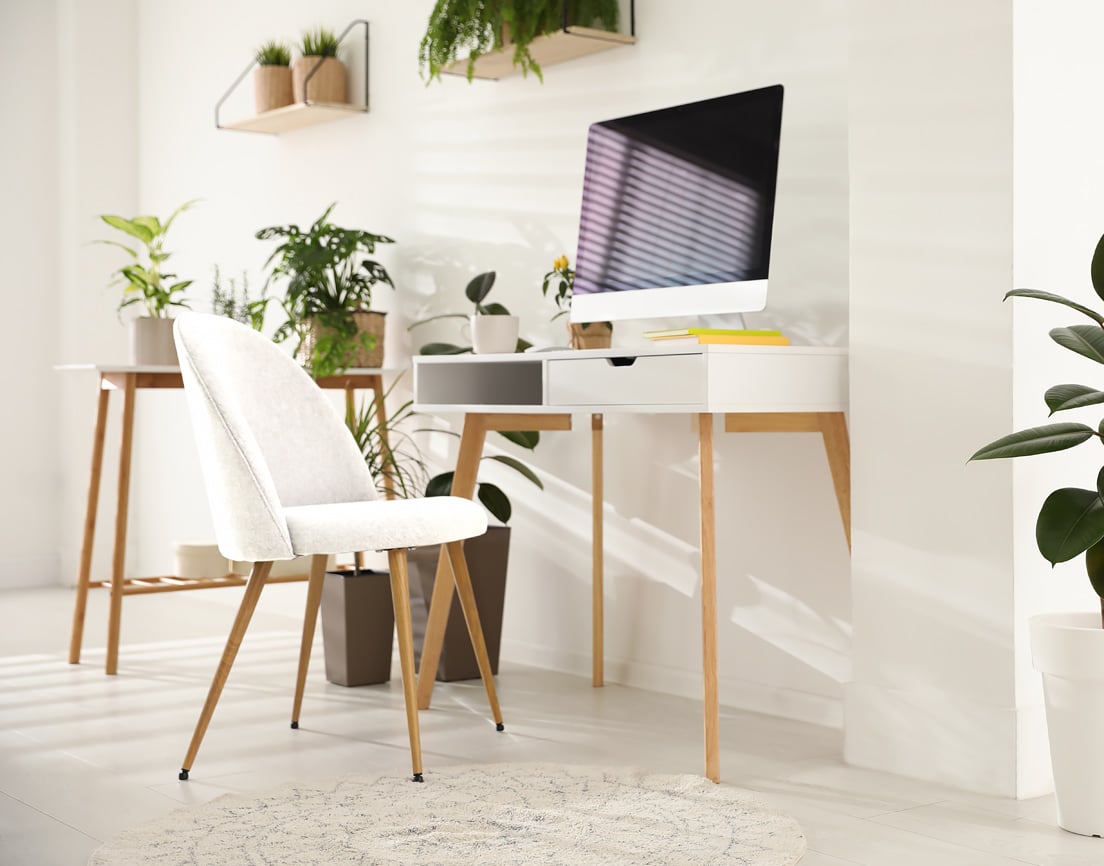 White fabric chair with fixed legs.