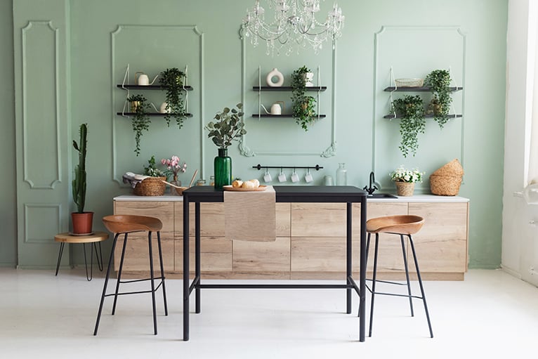 Two tone kitchen with green wall paint and wooden cabinets