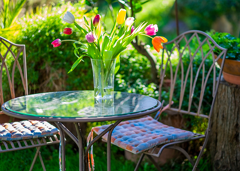 Tulips in vase on outdoor table