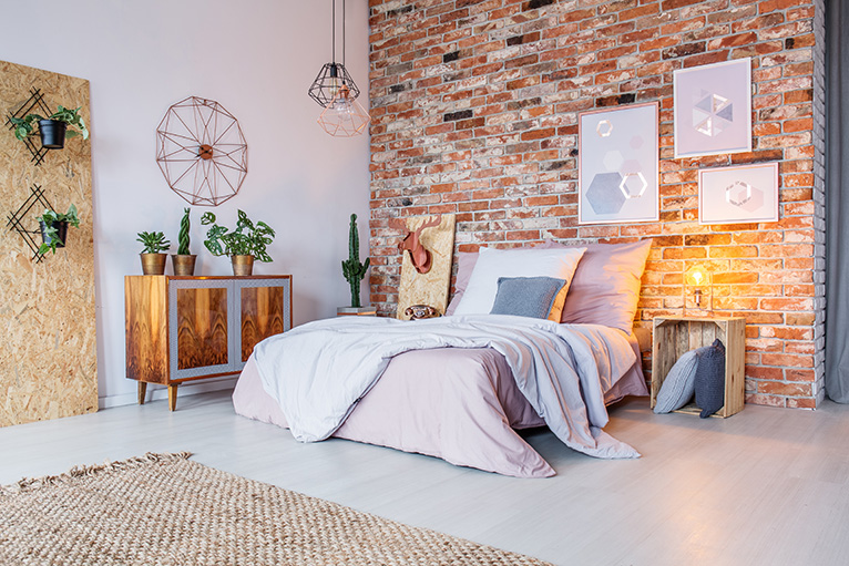 Unusual home: Bedroom with exposed brick wall