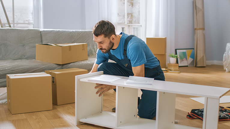 Homeowner demand: Handyman putting furniture together