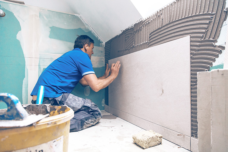 Homeowner demand: Tiler working in a home