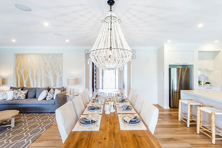 Chandelier hanging above dining table