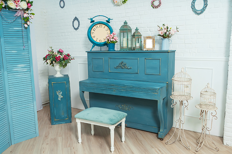 Blue piano in room with blue decor and interior design