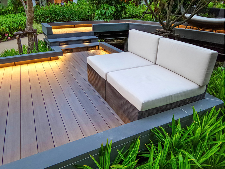 Garden walkway with seating and low lighting, in all year round garden