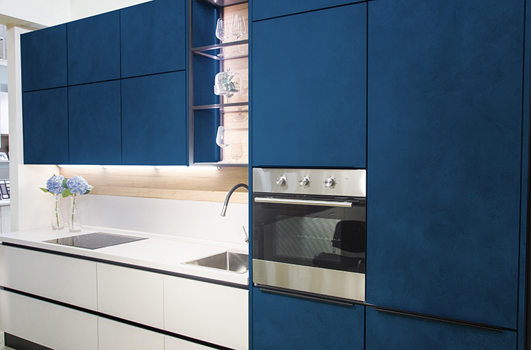Modern kitchen with dark blue cabinets
