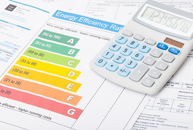 Energy efficiency rating with calculator and documents on table