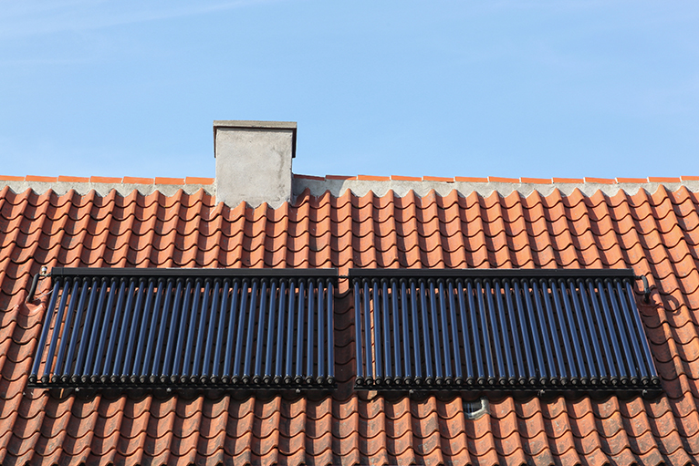 Energy efficiency home grants: Solar thermal panels on roof of house