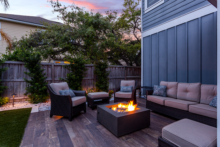 Gardening and landscaping trends: Firepit on patio in back garden