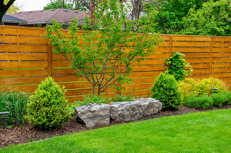 New minimalist-style fence in back garden