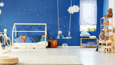 Childrens bedroom with swing and wooden furniture