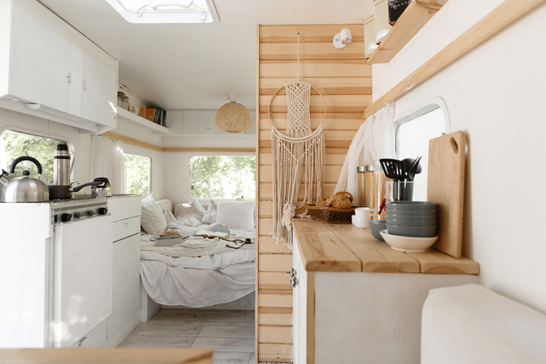 Kitchen and bedroom area in camper van
