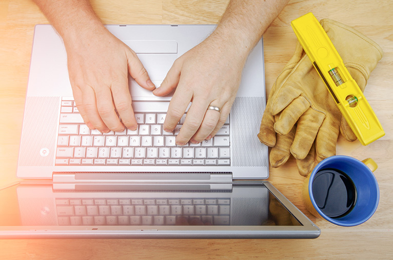 Tradesperson using laptop