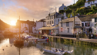UK holiday homes in the sunrise in a Cornish fishing village