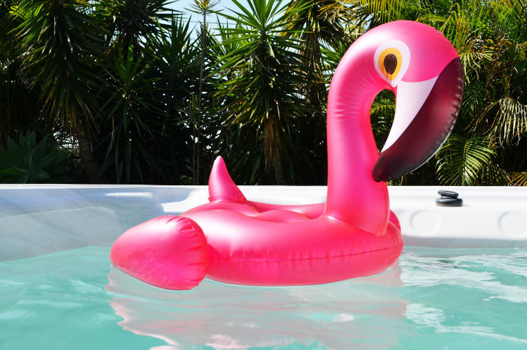 inflatable flamingo in a hot tub