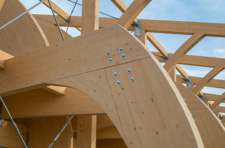 Close up shot house under construction, made up of thick mass timber. 