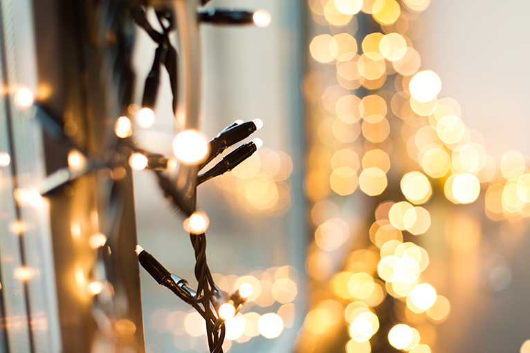 Wintery fairy lights hung on a conservatory door frame.