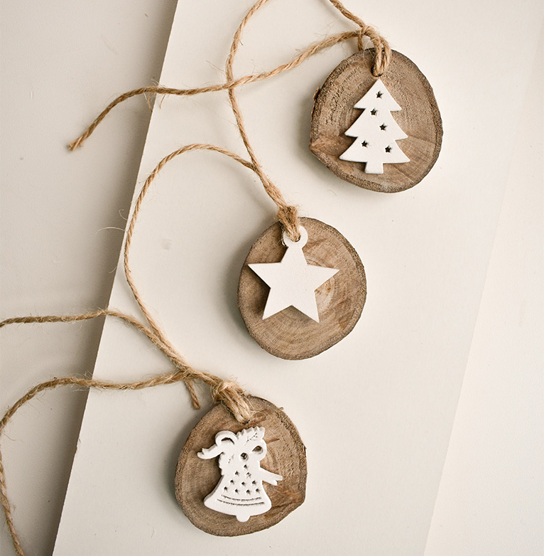 Wooden Christmas themed present tags with white 3D wooden designs.