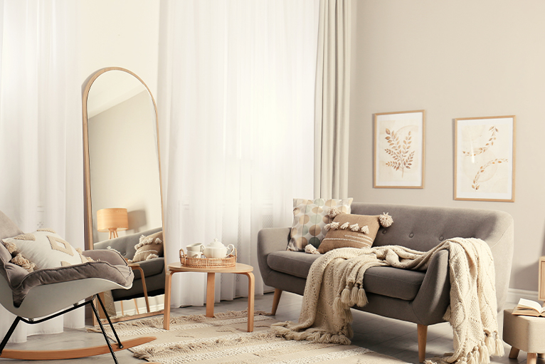 Picture of a living room with a large mirror and sofa