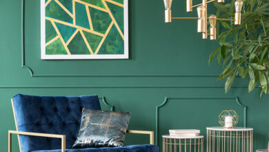 Picture of a living room with green walls and blue chair