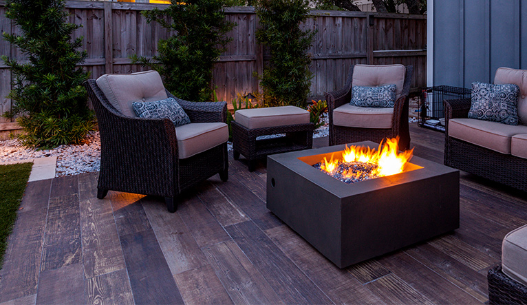 Outdoor furniture around a fire pit