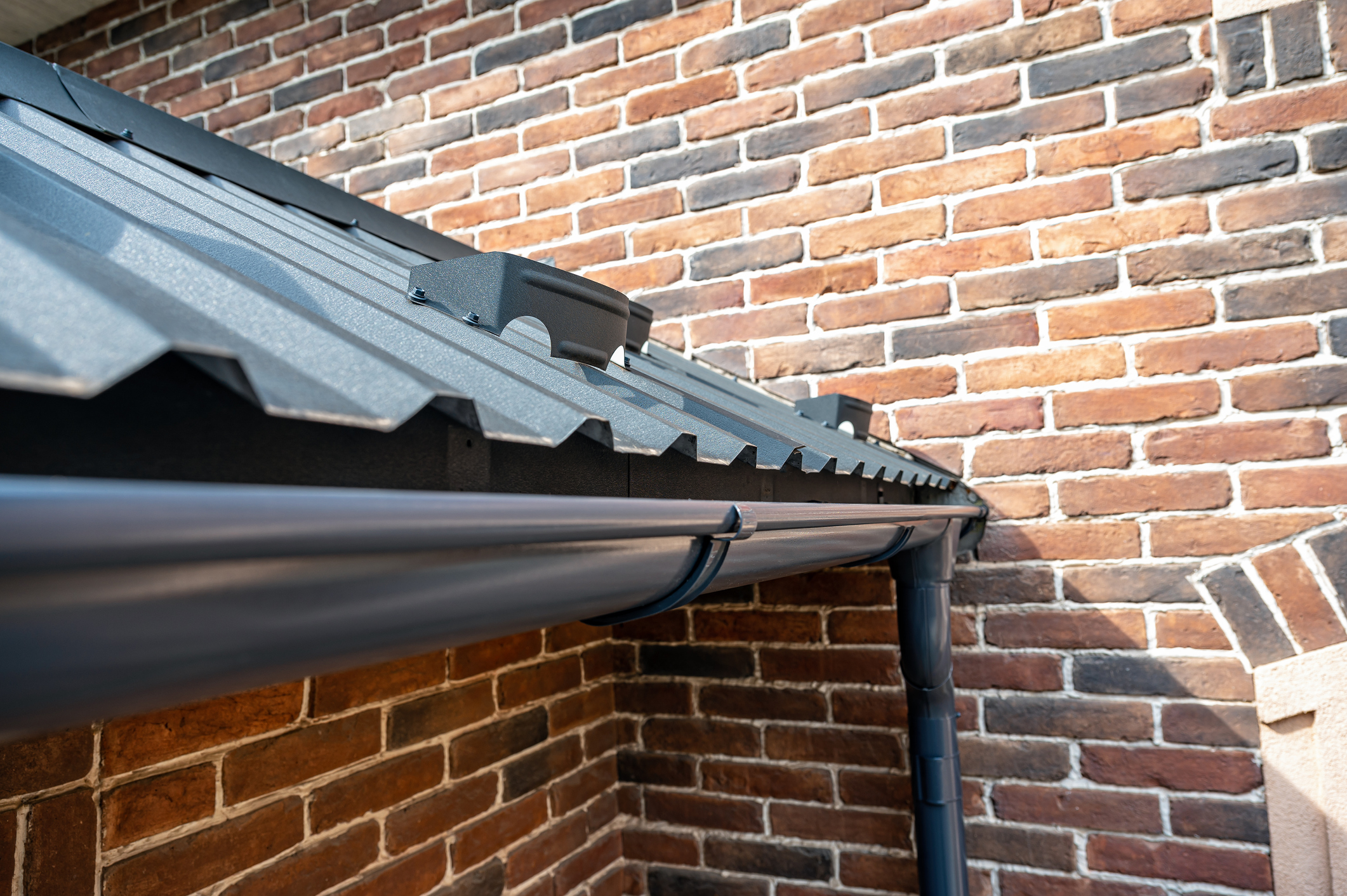 Gutter system for a metal roof.