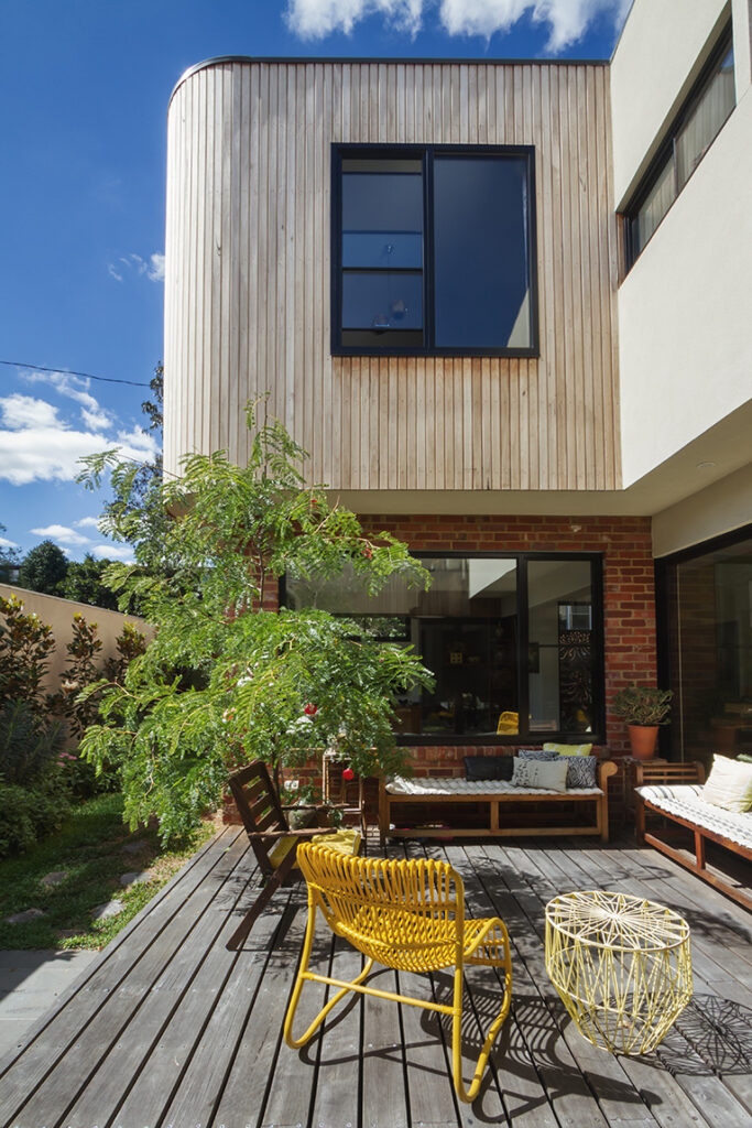 photo of a home extension built in timber on top of a kitchen with open balcony space in front
