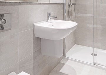 Photo of a modern bathroom with a semi-pedestal basin and shower enclosure.