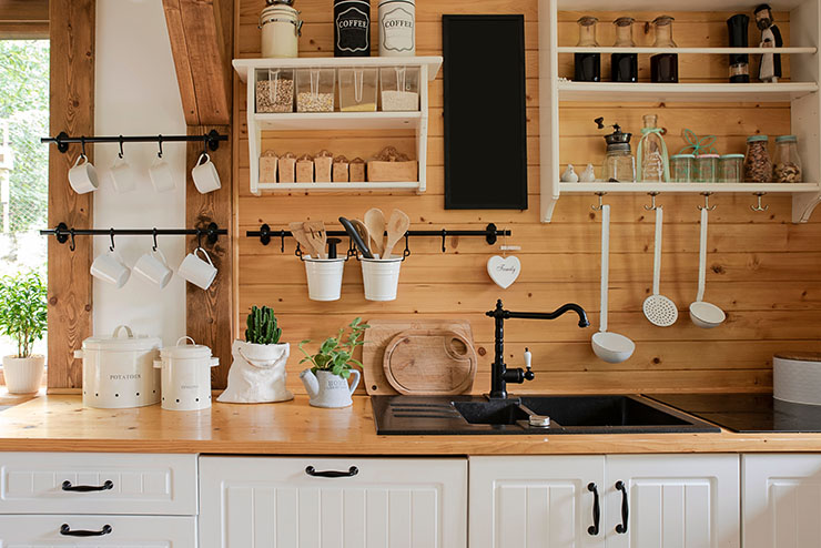 Image of a cottagecore design inspired kitchen with wooden walls and countertops