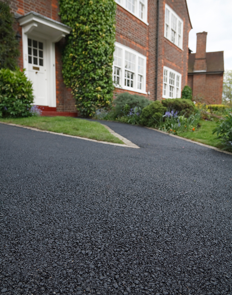 Picture of a house with a tarmac driveway