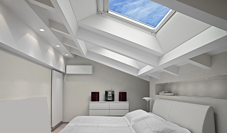 Picture of the inside of a house with a skylight roof window 