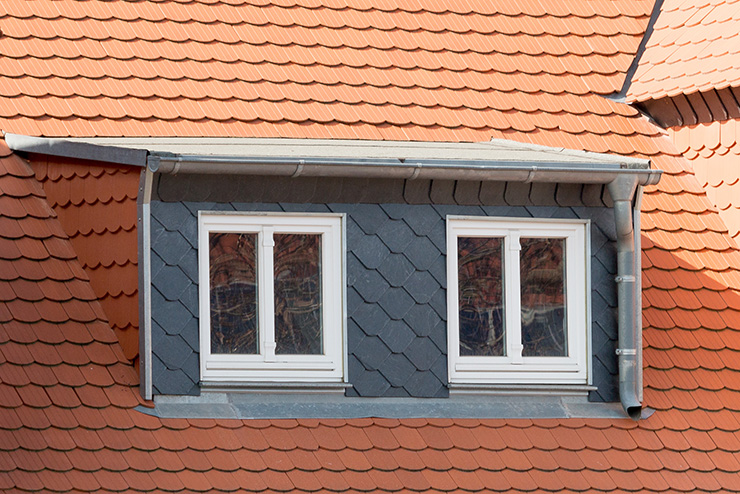 Picture of a loft with a dormer and two windows 