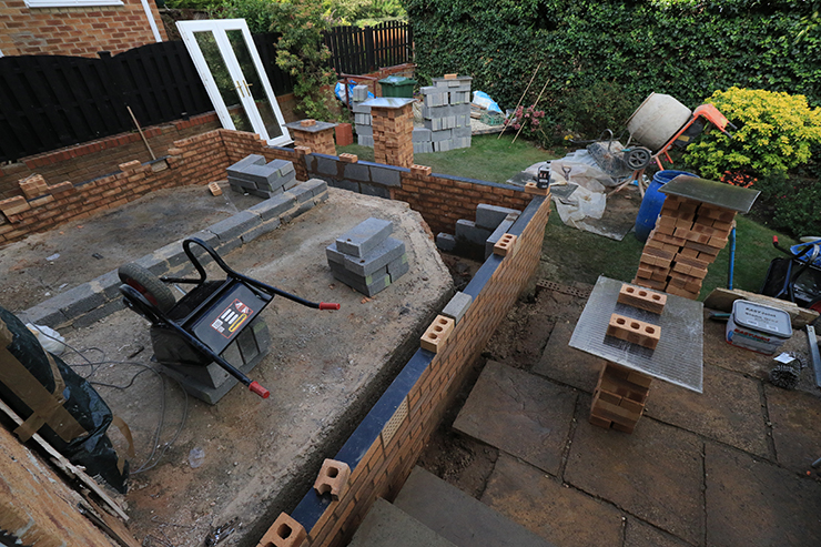 Picture of a conservatory being built in a rear garden