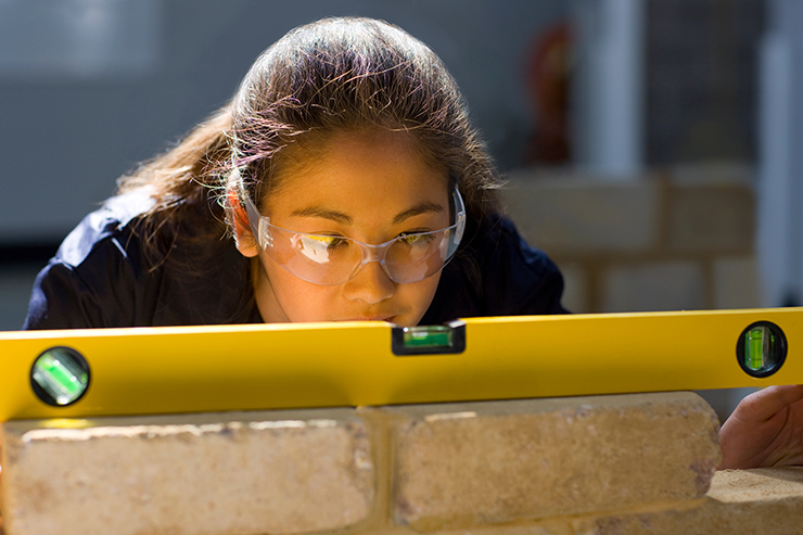 Photo of a female bricklayer apprentice