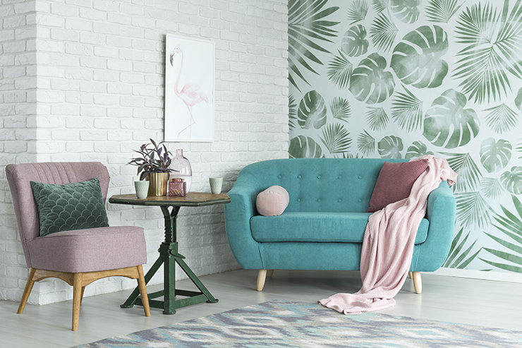 Picture of a room with green coloured furniture and plant themed peel and stick wallpaper