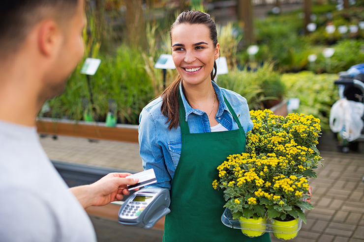 Picture of a man buying some flowers from a florist